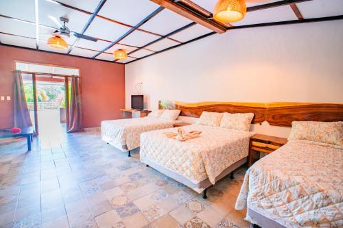 Ένα ή περισσότερα κρεβάτια σε δωμάτιο στο Casa Las Flores