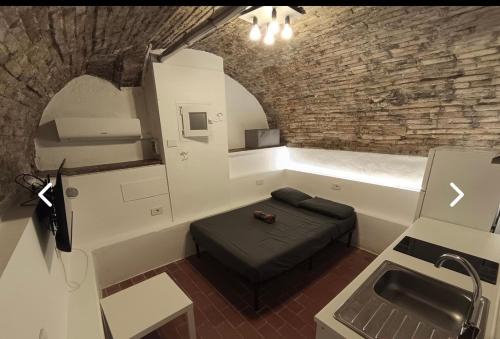 a living room with a couch and a sink at La Casa di Alissia a Brescia in Brescia