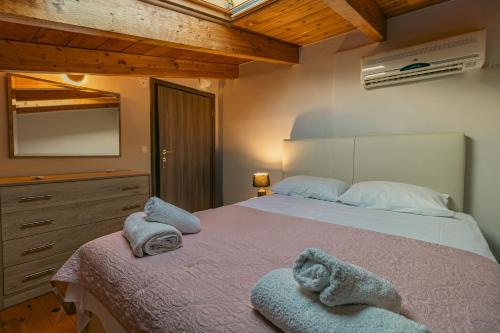 Ένα ή περισσότερα κρεβάτια σε δωμάτιο στο Vincenzo Villa Variko