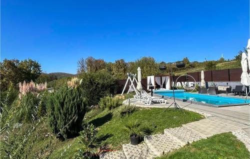a villa with a swimming pool and a resort at Gorgeous Home In Slavonski Brod With Sauna in Podvinje