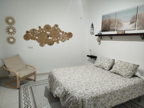 En eller flere senge i et værelse på Habitaciones Andaluzas