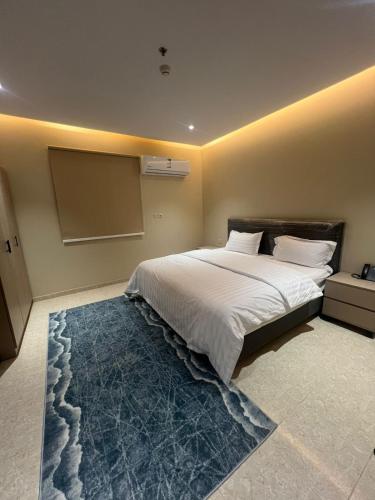 Ένα ή περισσότερα κρεβάτια σε δωμάτιο στο مرج الزيتون للشقق المخدومة