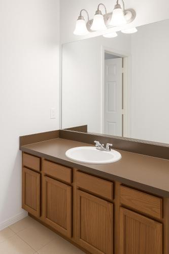 a bathroom with a sink and a mirror at Affordable Central Houston Stay Minutes from Downtown No Smoking in Houston