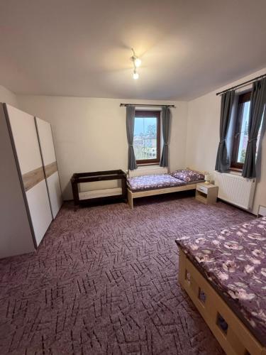 Postel nebo postele na pokoji v ubytování Apartmán Kristýna