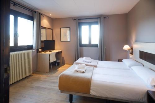 Ένα ή περισσότερα κρεβάτια σε δωμάτιο στο Hotel Port 1730