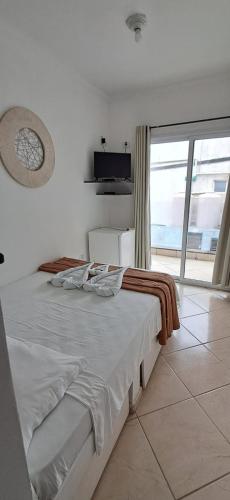 Ένα ή περισσότερα κρεβάτια σε δωμάτιο στο Pousada Mar Alto