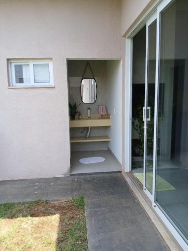 a room with a mirror on the side of a house at House snp in Sinop