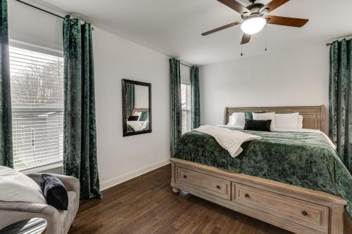 a bedroom with a bed and a ceiling fan at Hot Tub and Yard Temptation Stays Home in Roanoke in Cave Spring