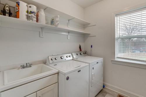 a white kitchen with a sink and a dishwasher at Hot Tub and Yard Temptation Stays Home in Roanoke in Cave Spring