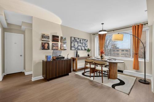 a living room with a table and chairs and a desk at CASA Arlington Suite with In-Suite Massage Chair & Premium Amenities in Arlington