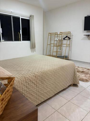 a bedroom with a large bed in a room at NEW! Loft in Cancun Center 5 mins from the ADO in Cancún