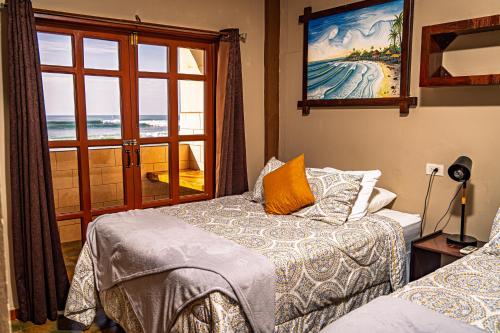 Ένα ή περισσότερα κρεβάτια σε δωμάτιο στο AST Surf Hotel