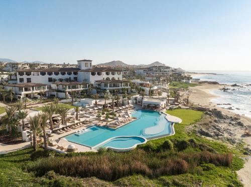 an aerial view of a resort with a swimming pool and the beach at Four Seasons Resort Cabo Del Sol in El Tule
