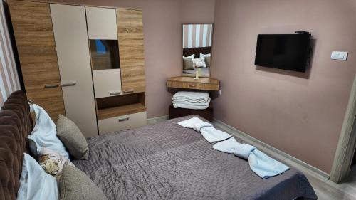 Ένα ή περισσότερα κρεβάτια σε δωμάτιο στο Apartman SIMONA