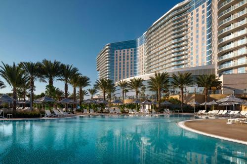 a large swimming pool in front of a resort at Gaylord Pacific Resort & Convention Center in Chula Vista