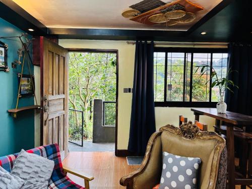 a living room with a couch and a table at WN Hilltop B&B by Smart Stay 2600 in Baguio