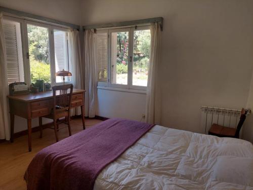 En eller flere senge i et værelse på La alborada - Casa de campo