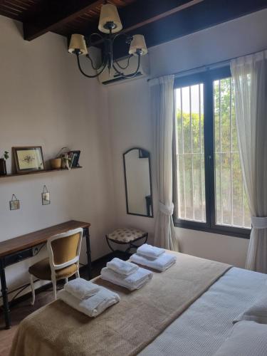 En eller flere senge i et værelse på Casita Mumi