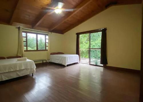 Ένα ή περισσότερα κρεβάτια σε δωμάτιο στο Chalet Campestre Lomas de Holanda