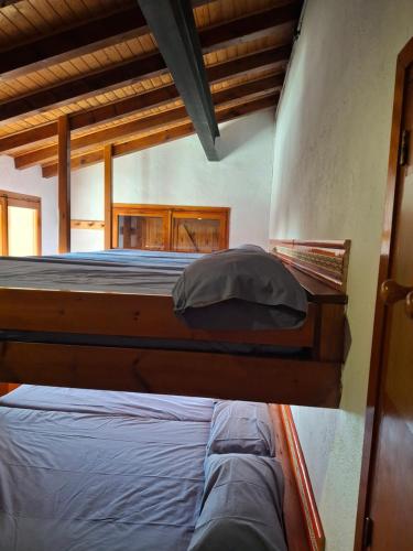 Postel nebo postele na pokoji v ubytování Xalet de muntanya en Parc Natural a 2000 metres