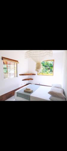 Ένα ή περισσότερα κρεβάτια σε δωμάτιο στο Jadypeba