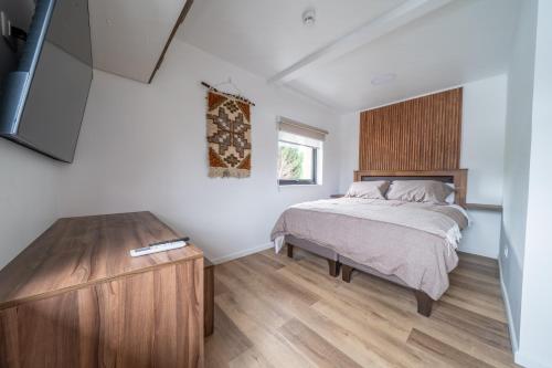 Ένα ή περισσότερα κρεβάτια σε δωμάτιο στο Millabú Hospedaje