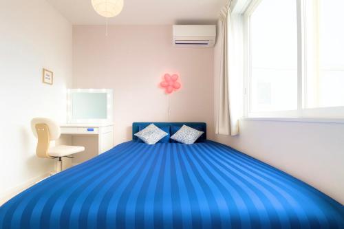 Ένα ή περισσότερα κρεβάτια σε δωμάτιο στο 夢富良野