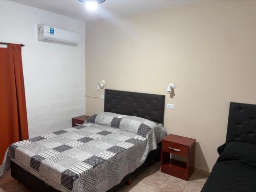 Postel nebo postele na pokoji v ubytování Departamento Genaro