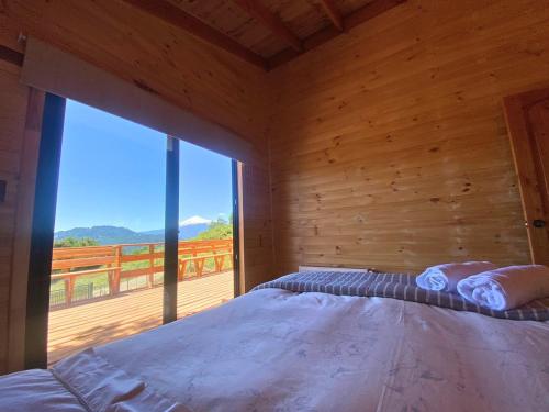 Ένα ή περισσότερα κρεβάτια σε δωμάτιο στο Casa Pullinque en Panguipulli