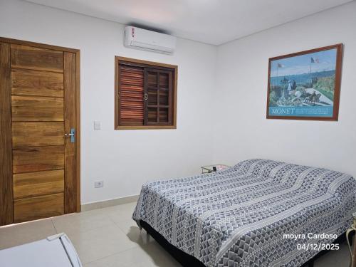 Postel nebo postele na pokoji v ubytování Flor de Jagube Guest House