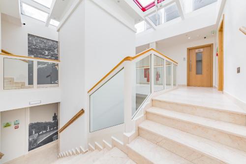 a staircase in a house with a skylight at The Lion & Key Hotel in London