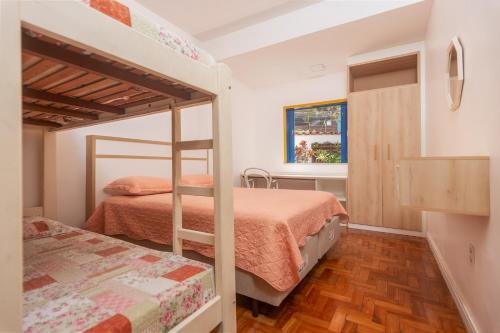 En eller flere senge i et værelse på Casa Praia do Forte