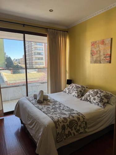 Ένα ή περισσότερα κρεβάτια σε δωμάτιο στο Apart Hotel Uman