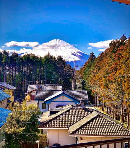 a view of a snow covered mountain with houses at Private Stay in Gotemba 縁 EN 403 in Gotemba