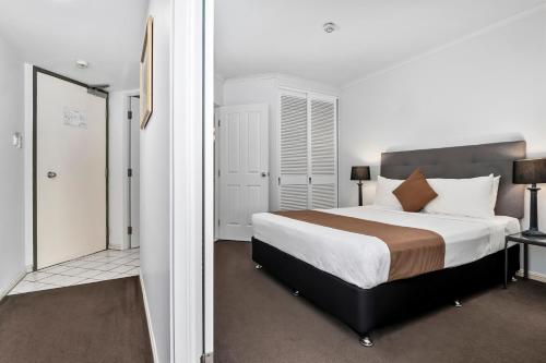 Ένα ή περισσότερα κρεβάτια σε δωμάτιο στο Il Centro Apartment Hotel