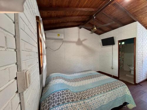 En eller flere senge i et værelse på Casa refugio Natural