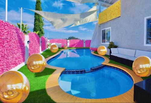 a house with a swimming pool in the yard at Casa de Bloom Venue - Your Perfect Event Space in San Diego
