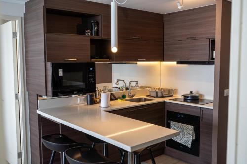 Кухня или мини-кухня в Exclusivo departamento con vista al mar
