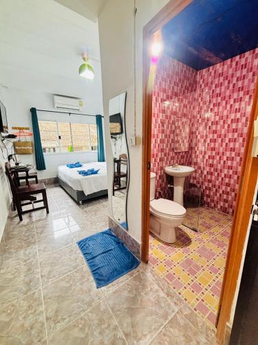 a bathroom with a shower and a toilet in a room at Miss Hong House in Ko Samed