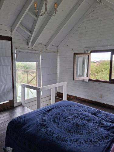 Giường trong phòng chung tại Cabaña en Punta Rubia beach, Rocha