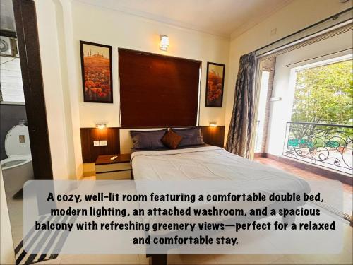 a bedroom with a bed with a window at Marvella Stays in Anjuna