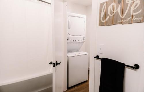 a white washer and dryer in a white room at Luxury Mountain Views at Prime Location Huntsville in Huntsville