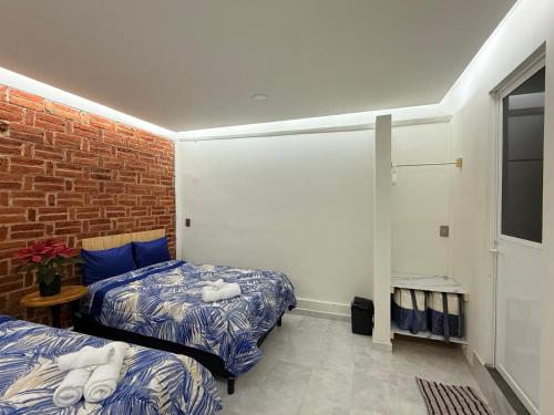 Ένα ή περισσότερα κρεβάτια σε δωμάτιο στο Hacienda Xancalle