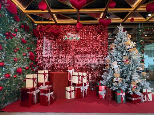 a room filled with christmas trees and presents at PHUC LONG LUXURY Danang in Da Nang