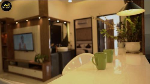 TV a/nebo společenská místnost v ubytování Kaattil Homes