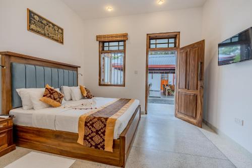 Postel nebo postele na pokoji v ubytování The Mansion Koggala