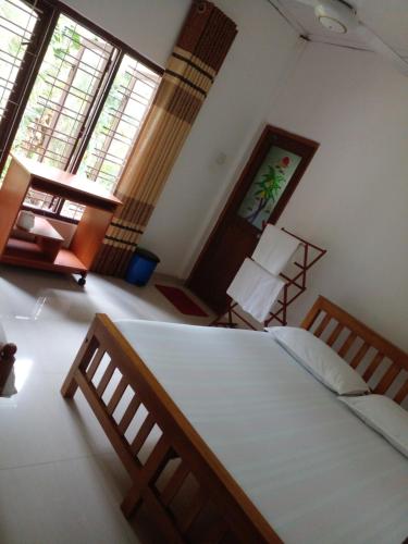 Una cama o camas en una habitación de Muthu Villa