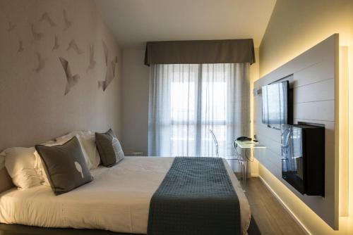 TV a/nebo společenská místnost v ubytování Ariae Dépendance - Alihotels