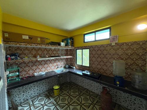 Η κουζίνα ή μικρή κουζίνα στο Cozy Nest