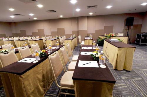 a conference room with long tables and chairs at Seeds Hotel Premier Pudu Kuala Lumpur Previously Hotel Pudu Plaza KL in Kuala Lumpur
